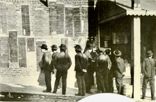 Chinese men reading Tong notices, 1900, San Francisco